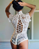 White floral lace bodysuit with crisscross lace-up open back and tie detailing