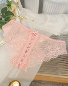 Pink lace panties with lace-up crisscross panel and scalloped lace trim