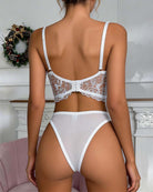 Back view of white sheer floral-embroidered bralette and lace thong panties set