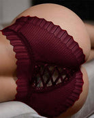 Red lace crisscross panties with scalloped edges and crisscross cutout