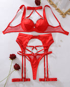 Red satin lingerie set flat lay: underwire bra, high-waist thong, garter harness