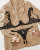 Cupless lace bra and crotchless thong set in black lace with scalloped ruffle trim