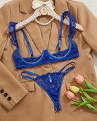 Cupless lace bra and crotchless thong set in blue lace with scalloped ruffle trim