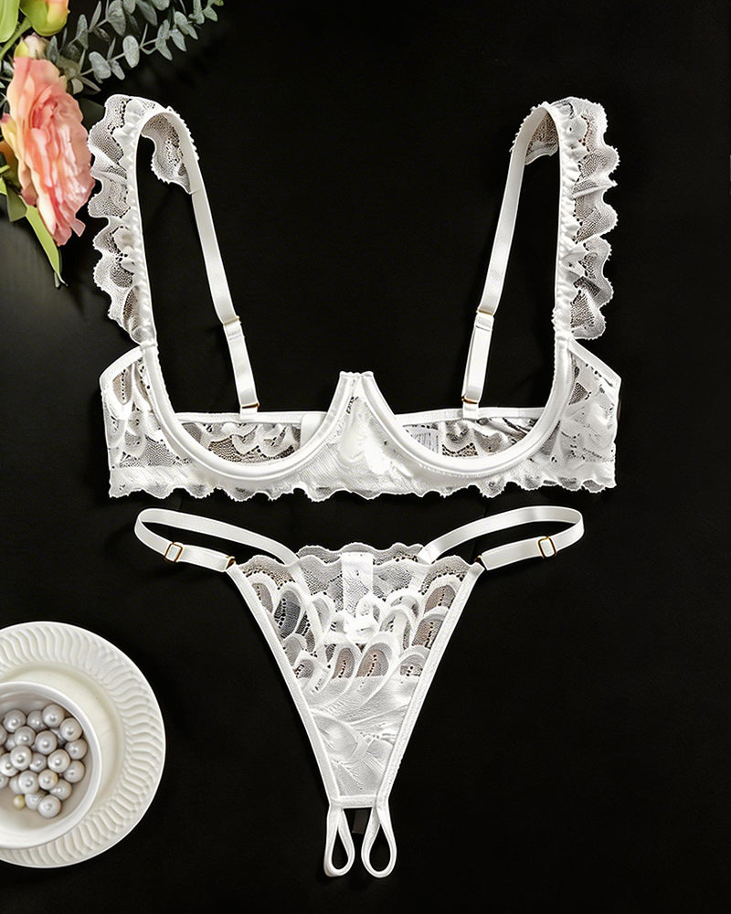 White lace cupless bra and crotchless thong with scalloped edges and adjustable straps