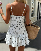 White polka dot halter mini dress with open back and ruffled hem