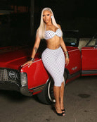 White polka-dot halter crop top and high-waisted capri pants set