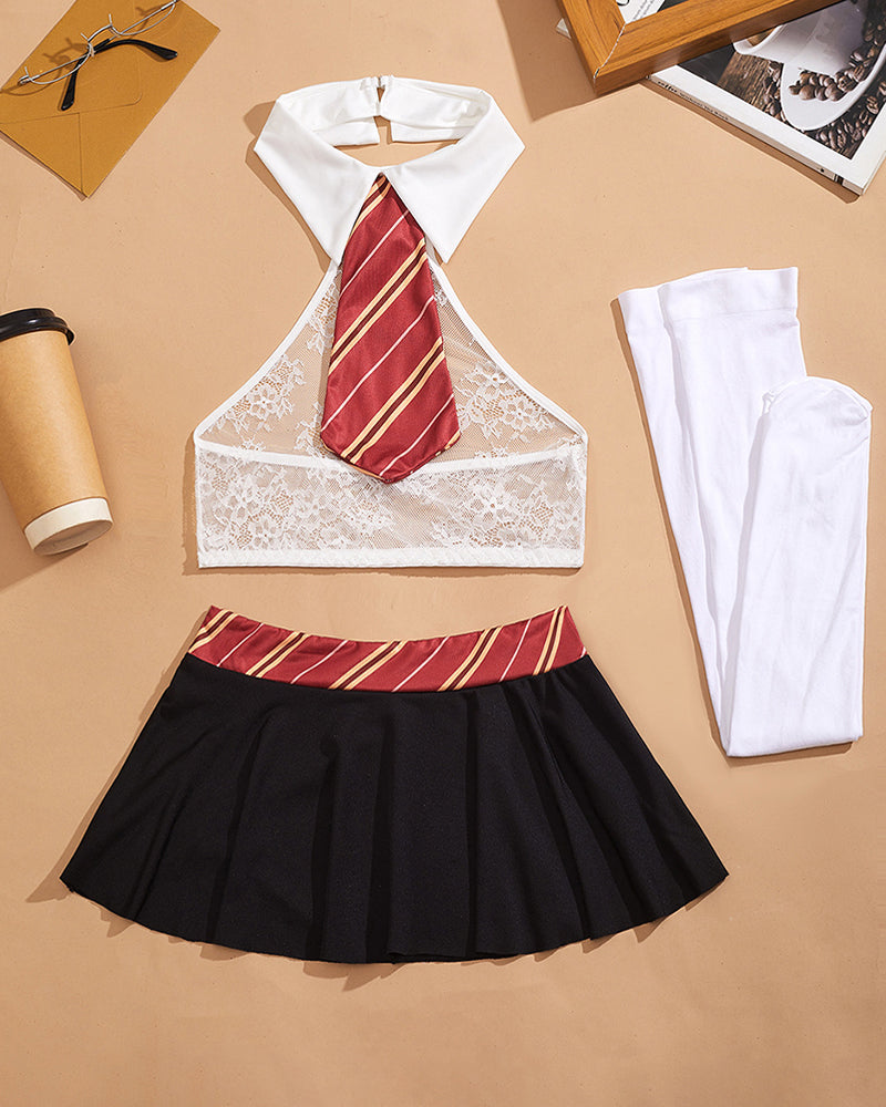 Flat lay: lace halter crop top with red striped tie, black pleated mini skirt, white thigh-highs