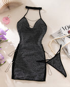 Black glitter halter mini dress with chain trim and matching thong, flat lay