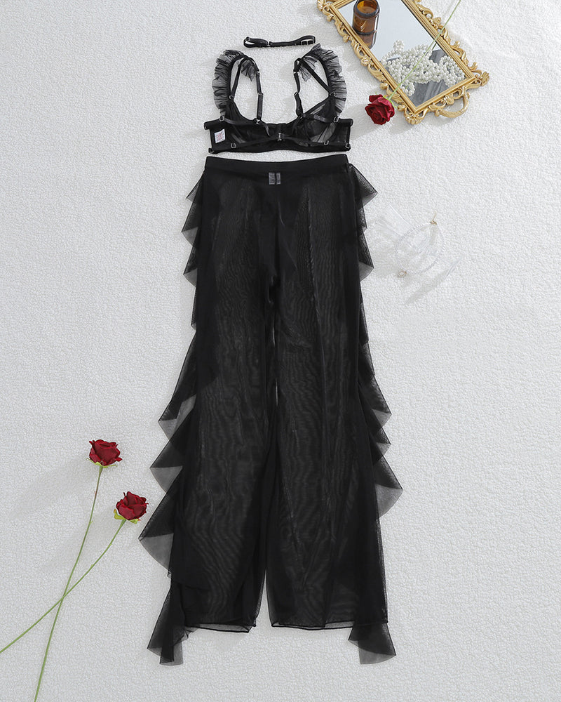 Black sheer lace bralette and mesh pants set with ruffled neckline, flat lay