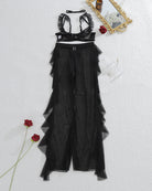 Black sheer lace bralette and mesh pants set with ruffled neckline, flat lay