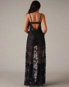 Black lace corset maxi dress with open back and long sheer lace skirt overlay