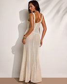 Back view beige crochet maxi dress with open-back spaghetti straps and star appliques
