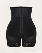 Black high-waisted shapewear shorts with front hook panel and lace leg hems