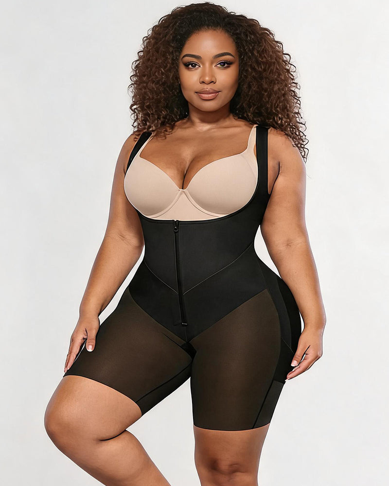 Black front-zip shapewear bodysuit with light beige bust panel and high-leg fit