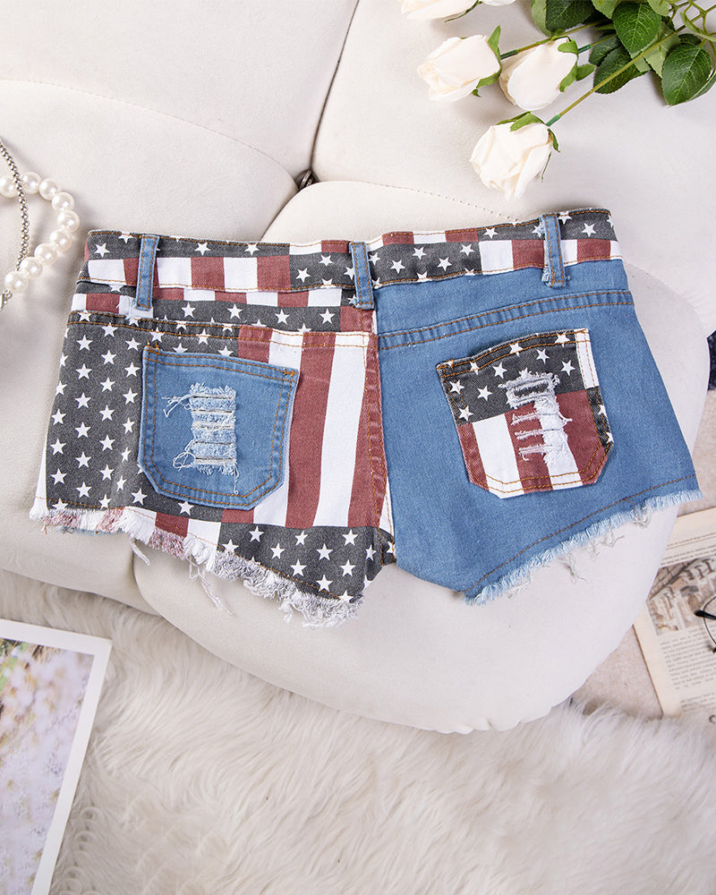 High-waisted distressed denim shorts with American flag patch pockets, frayed hem