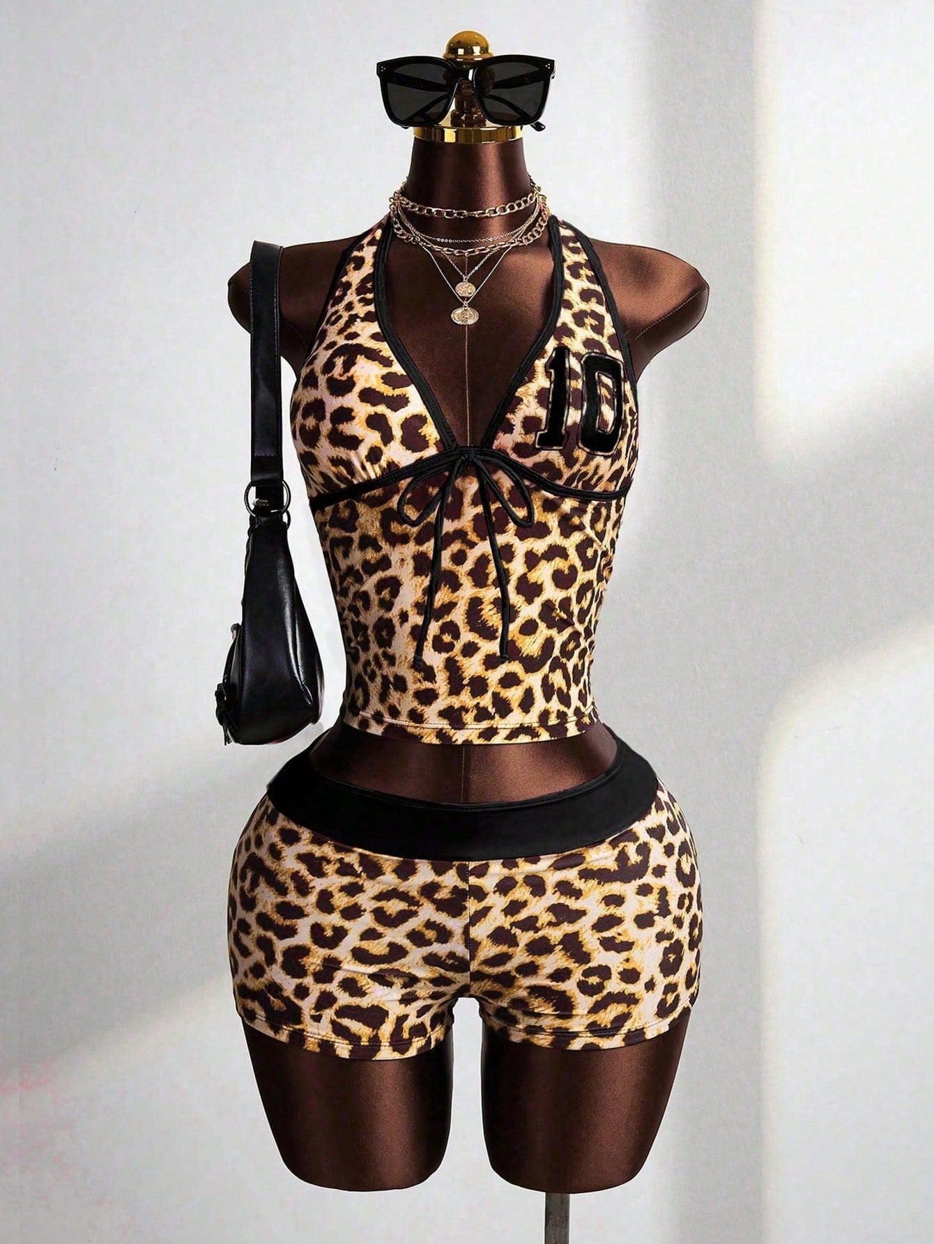 Leopard print halter crop top and high-waisted shorts set with black waistband trim