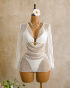 White sheer crochet long-sleeve cover-up over bikini set on a mannequin