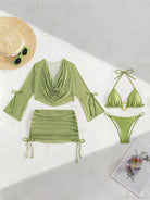 Green bikini set pieces: long-sleeve cover-up top, ruched mini skirt, triangle bikini