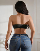 Black strapless bandeau top with open-back styling and front buckle closure