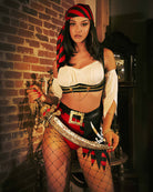 Pirate wench costume set with white crop top, black/red skirt, fishnet tights, red headscarf