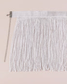 White rhinestone fringe mini skirt with dangling tassels and chain side strap