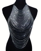 Silver rhinestone halter top displayed on black mannequin form