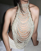 White pearl halter fringe crop top with layered bead strands and open neckline