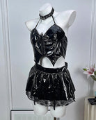 Black patent halter crop top and mini skirt with choker, shown on mannequin torso