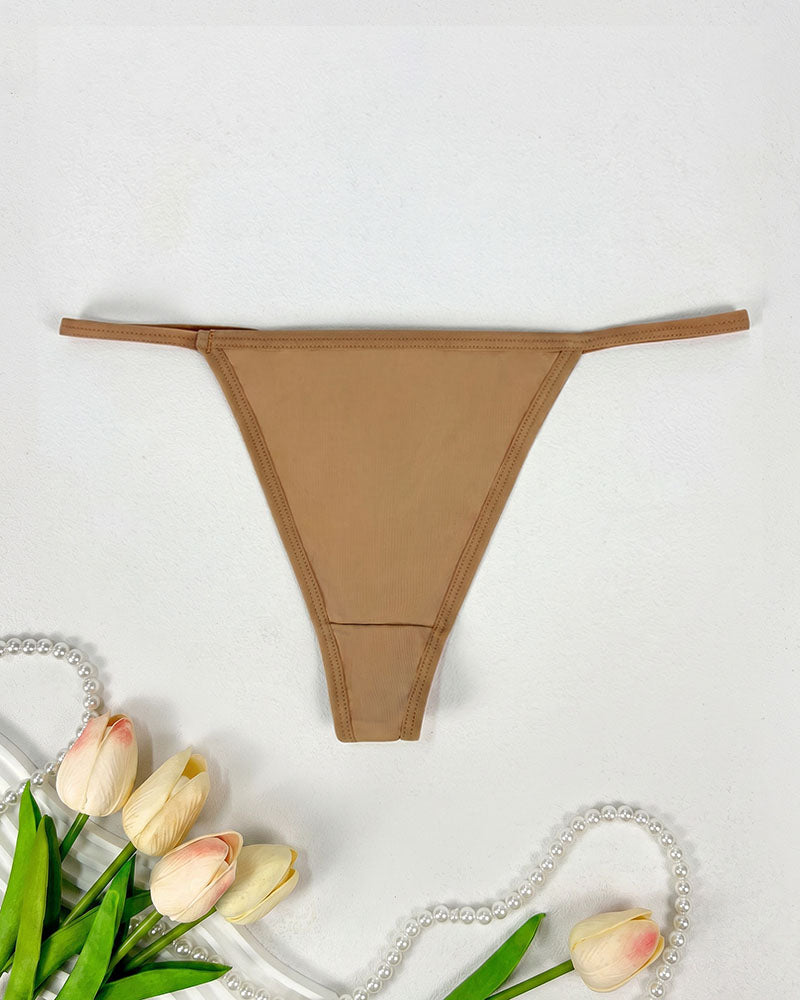 Low-rise thong panties in tan with smooth seamless design and soft coverage.
