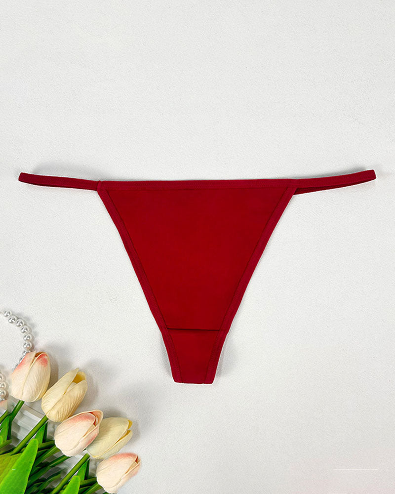 Low-rise thong panties in red with seamless soft stretch fabric and low-rise fit.