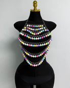Multicolor beaded body chain on mannequin, layered pom-pom strands with chain links