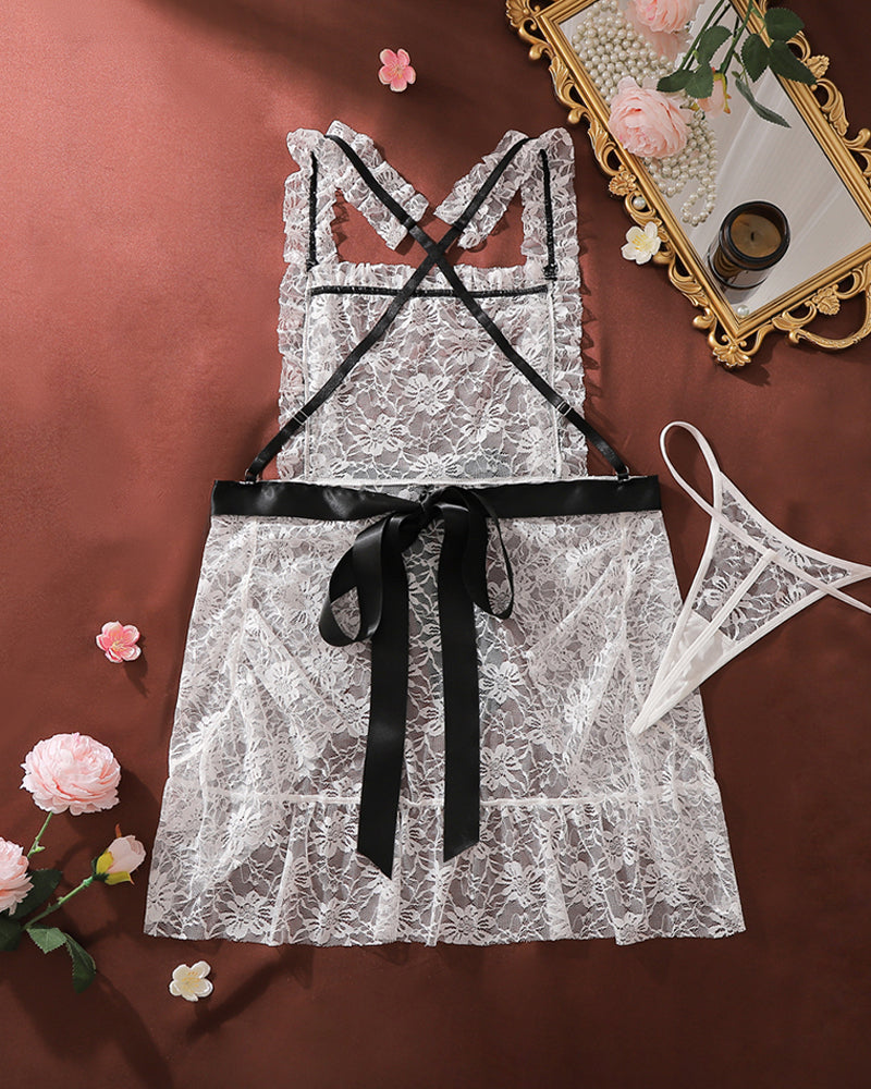 White lace chemise mini dress with black crisscross straps and bow, plus lace panty