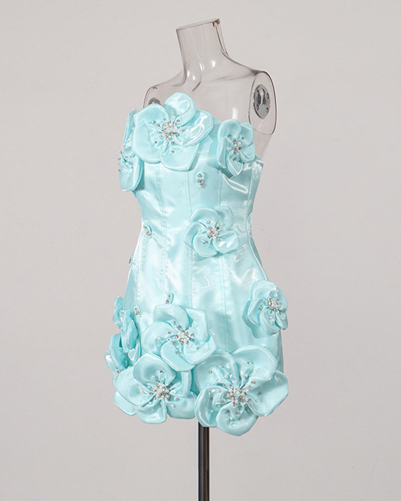 Sky blue strapless corset mini dress on a mannequin with layered flower embellishments.