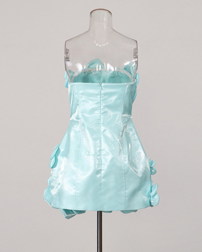 Sky blue strapless corset mini dress on a mannequin with side 3D floral accents.