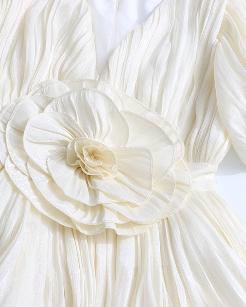 Champagne pleated mini dress with puff sleeves and large rosette floral waist detail