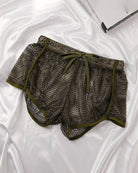 Army green open mesh drawstring shorts with elastic waistband and loose leg.