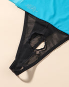 Sheer black mesh G-string thong close-up, black elastic trim
