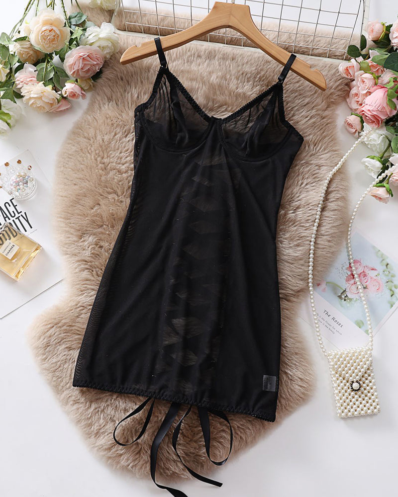 Black sheer mesh underwire mini dress laid flat, spaghetti straps and tie detail
