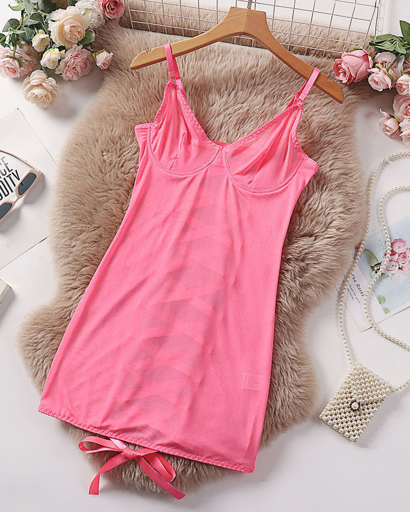Pink sheer mesh underwire mini dress laid flat with tie hem and spaghetti straps