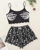 Black skeleton-print cami crop top and matching pajama shorts set, flat lay