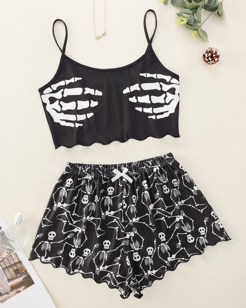 Black skeleton-print cami crop top and matching pajama shorts set, flat lay