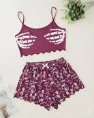 Purple skeleton-print cami crop top and matching pajama shorts set, flat lay