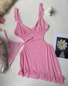 Pink sheer mesh mini dress flat lay with cutout sides and ruffled hem trim