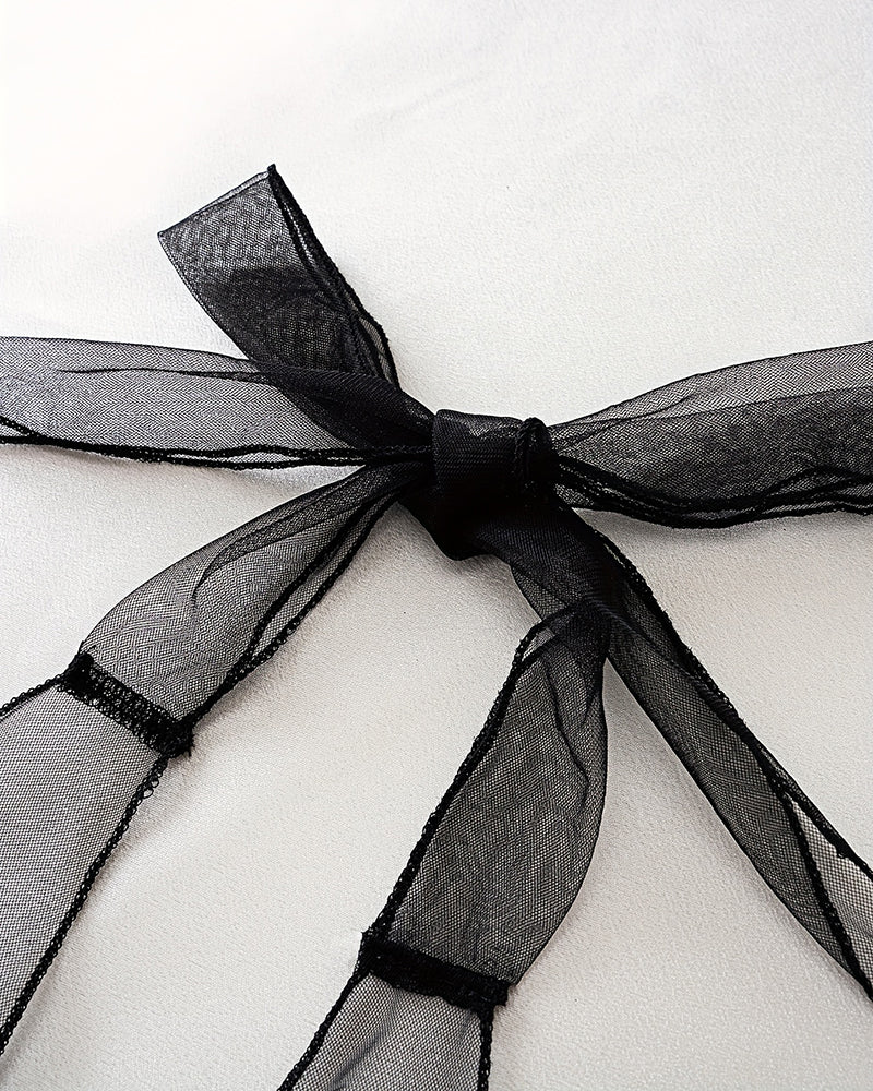 Black satin bow ribbon detail on sheer mesh halter bodysuit