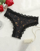 Black lace-trim thong panty with orange Halloween pumpkin print