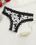 White lace-trim thong panty with black Halloween character print