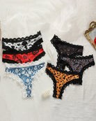 Set of Halloween lace-trim thong panties in black, blue, red, and orange