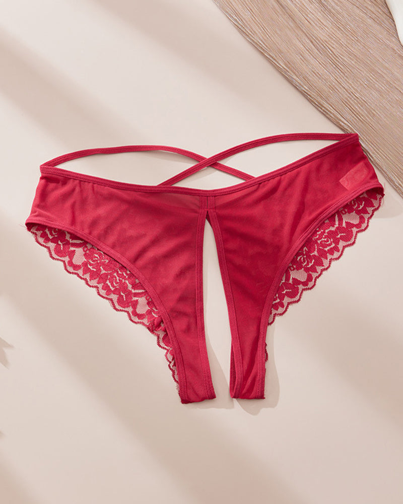 Red satin-like crotchless panties with lace trim and criss-cross strap design