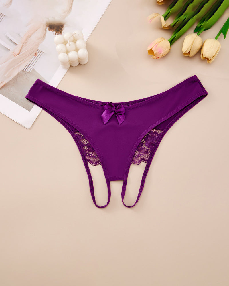 Plus size purple crotchless lace thong with lace-trim waistband and center bow