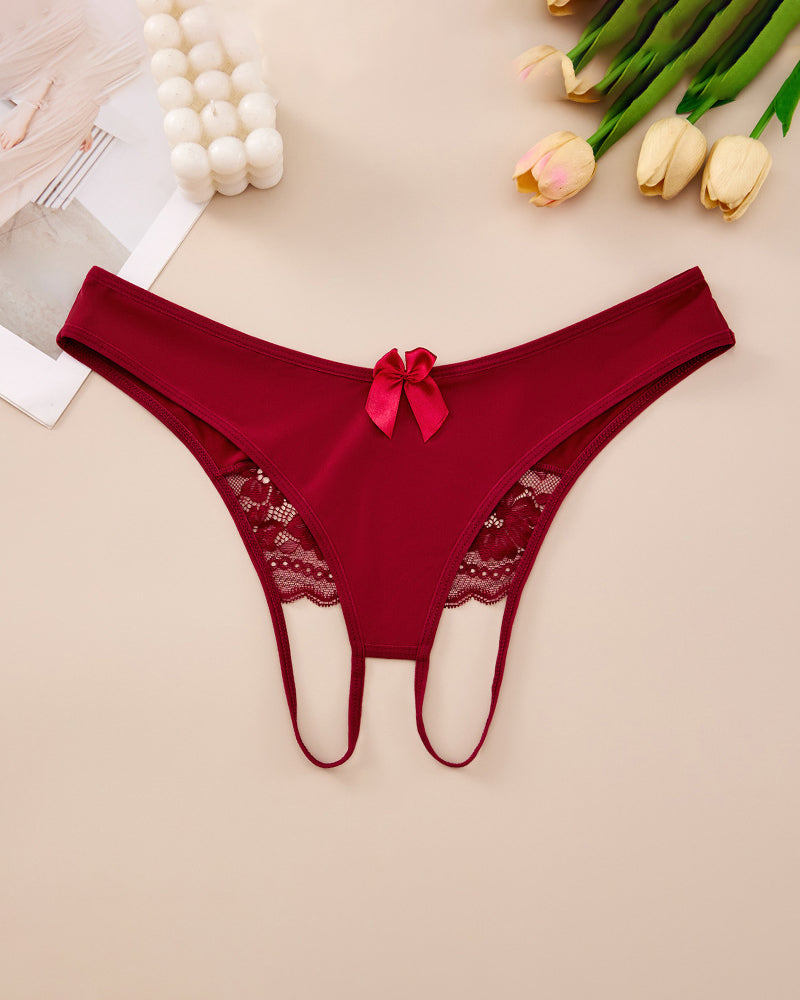 Plus size red crotchless lace thong with lace-trim waistband and center bow